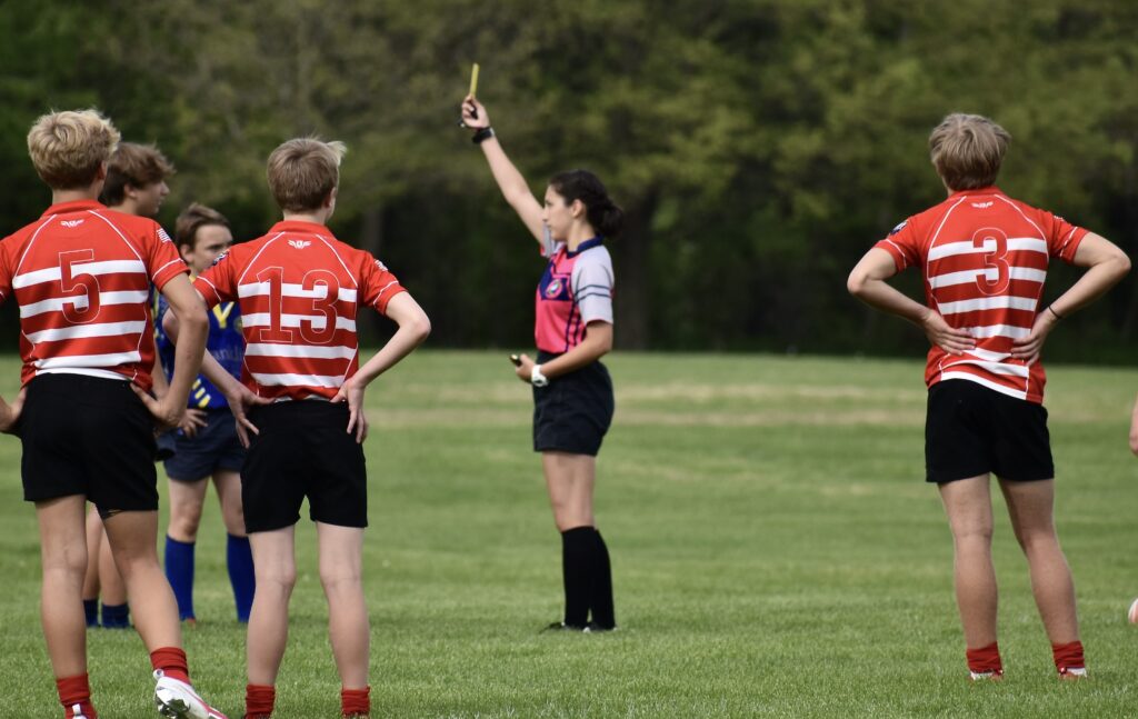 Coco Nate refereeing a rugby game